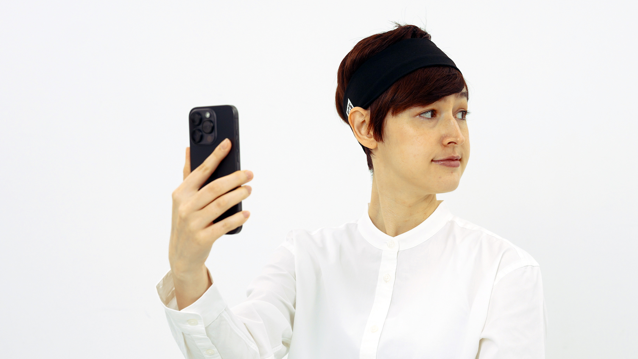 A young person scanning their ears with the Final Audio TONALITE app